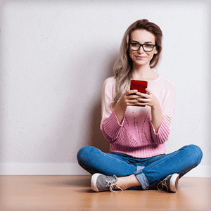 young woman downloading heartsapp on her phone